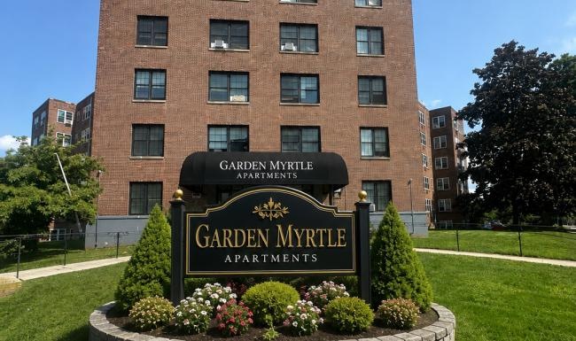 a sign in front of a building