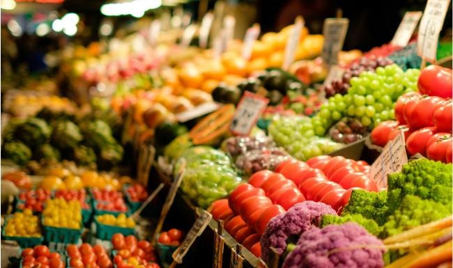 a market with vegetables and fruits